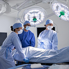 Amico Spectra V-Series Surgical Ceiling Pendant with operating room staff