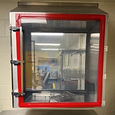 A CleanSeam™ pass-through for pharmacy use