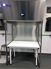 Programmable stainless steel vertical laminar flow hood over a workbench