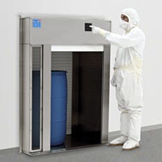 Installed roll-up pass-through floor-mounted with brackets and air shower in use