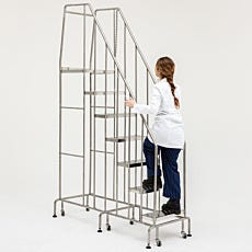 Round tube mobile step ladder being pushed