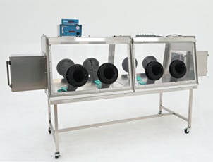 Double-sided stainless steel glovebox isolator to seal vials of hygroscopic material