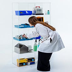 immediate access dispensing cabinet with props and model reaching in