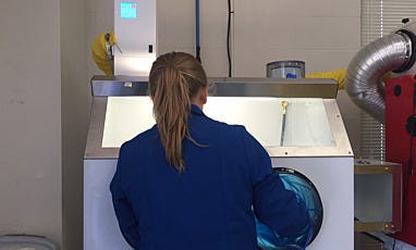 User with Open Loop Filtration Glovebox