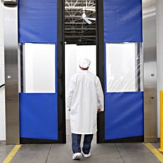 view of rite-hite split door with man walking in