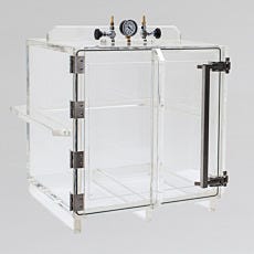 transparent acrylic plastic vacuum chamber with front-facing swinging door