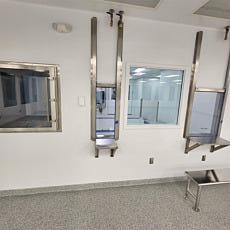 Vertical sliding convenience window pass through