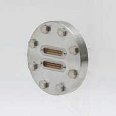 Close up of a multi-pin feedthrough on a benchtop vacuum chamber