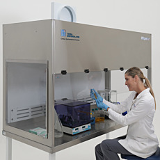 Benchtop laminar flow hood with optional removable rear plenum for exhaust or recirculation