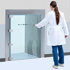 Researcher opening BioSafe CleanMount pass-through glass door