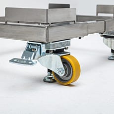 The foot pedal sets the caster brakes to prevent movement for the mobile base
