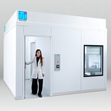 Researcher exiting BioSafe modular cleanroom through anteroom
