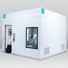 Researcher waving from BioSafe cleanroom anteroom