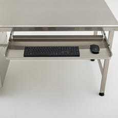 close up higher view of keyboard tray attached to worksation