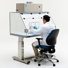 scientist using fume hood with blower module