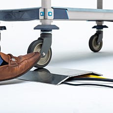 cable raceway with low profile design allowing clearance for mobile caster wheel.