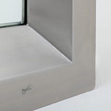 Stainless steel continuous-welded seam on center-mount cleanroom window corner