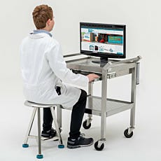 Ergonomic cleanroom computer cart being used by a lab technician as a desk