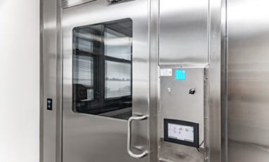 Cleanroom entry door with window and electronic control panel
