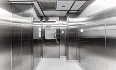 Cleanroom entry or transition area with stainless steel door and window