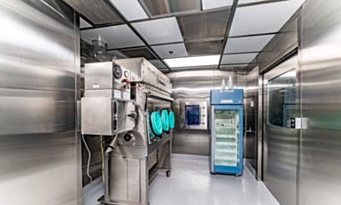 Hazardous cleanroom with isolator, refrigerator, and pass-through chamber