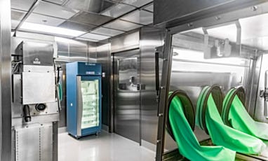 Cleanroom hazardous compounding area with isolator and refrigerator