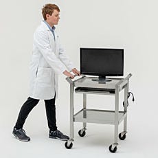 Cleanroom workstation cart being pushed by lab technician
