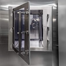 Cleanroom pass-through chamber with glass door open
