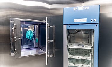Cleanroom pass-through chamber with gloves and medical refrigerator