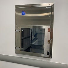 Cleanroom passthrough with recirculating HEPA filtration for gene therapy research