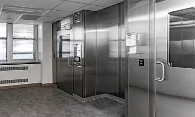 Cleanroom entry with stainless steel doors and hand sanitizer dispenser