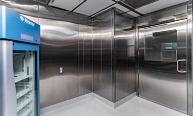 Cleanroom with stainless steel walls and Helmer laboratory refrigerator