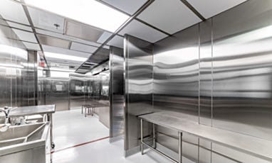 Cleanroom workspace with stainless steel benches and sink