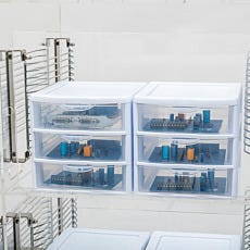 Closeup of smaller desiccator drawers storing electronic components within a desiccator chamber