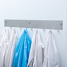 Wall-mounted cleanroom coat rack for gowning room garment storage