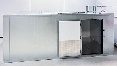 side view of custom cold room with left-hand-swing door