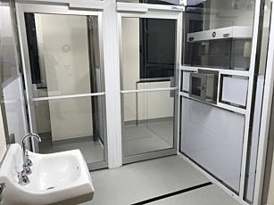 Cleanroom wall partition and door to convert room into compounding cleanroom