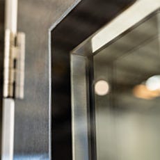 Flush-mount window for BioSafe® pre-hung door allows for easy sterilization
