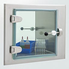 Photo of a stainless steel pharmacy pass-through featuring a frameless glass door
