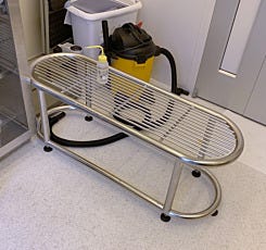 Cylindrical gowning bench in the gowning room of a biotechnology lab
