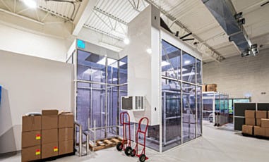 outside side angle of cleanroom next to trolleys and packages