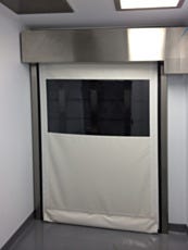 full view of white high speed roll up door