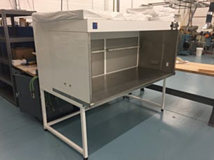 HEPA-filtered horizontal laminar flow hood with ion bars for optics