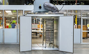 Drying room connected to a cleanroom with a model pushing a cart inside it