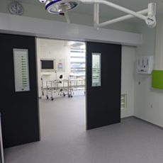 Hygienic sliding Bi-Parting FRP Fire-Rated Medical Doors by Dortek
