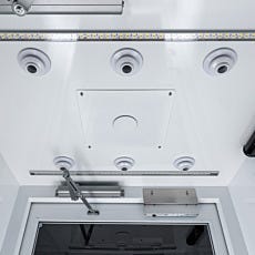 full view of sprinkler head intergrated into air shower