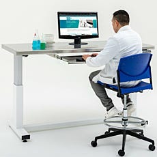 Keyboard tray mounted to adjustable-height cleanroom table