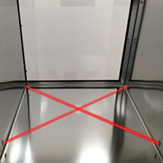 Infrared Load Presence Sensor installed inside cleanroom passthrough