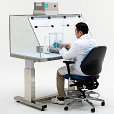 mini reverse flow ffu on valuline fume hood with person in front of it