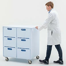 Laboratory technician moving mobile storage cart with polyurethane casters